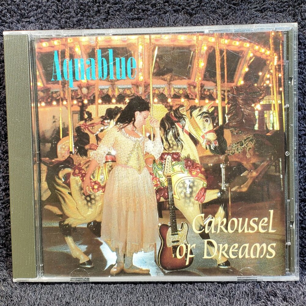 VINTAGE AQUABLUE...CAROUSEL OF DREAMS...COMPACT DISC... A BBMP SERIAL # 0003